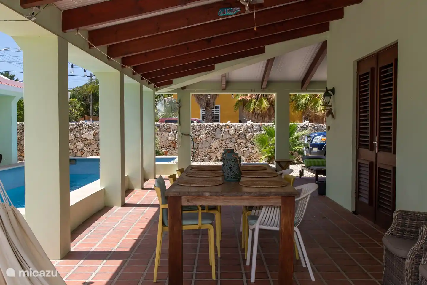 The large porch, your permanent home! Large table with comfortable chairs. Also several sun loungers and outdoor shower serving the pool.