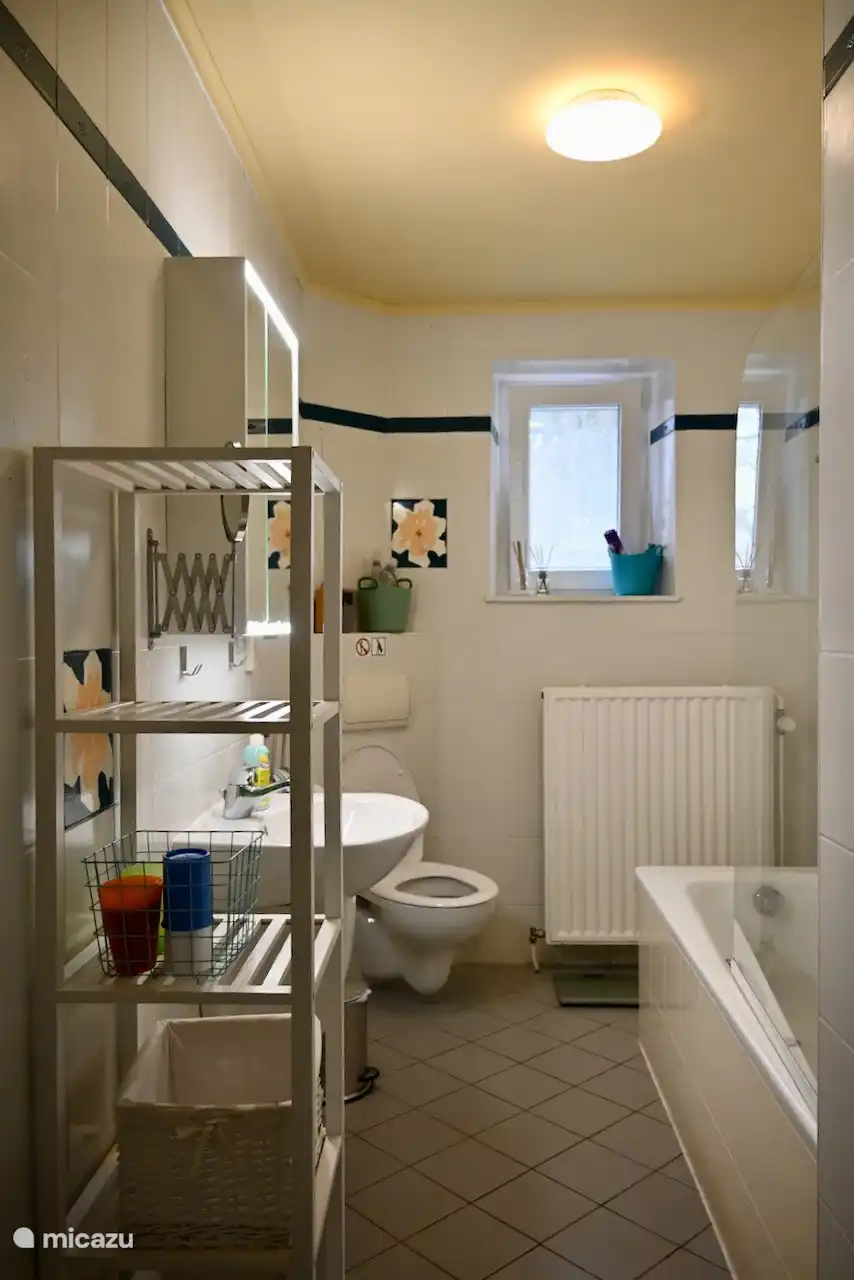 downstairs bathroom with bath and toilet