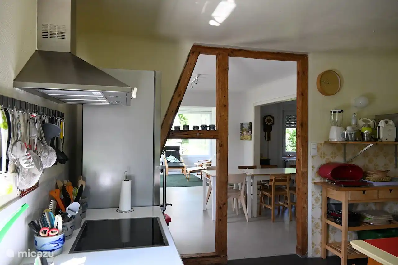 The kitchen, connected to the living room, is equipped with every convenience