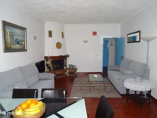 The living room with the right hallway to bedrooms and bathrooms.