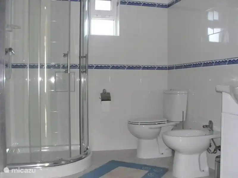 The beautiful spacious bathroom is identical to the bathroom in the Cottage.