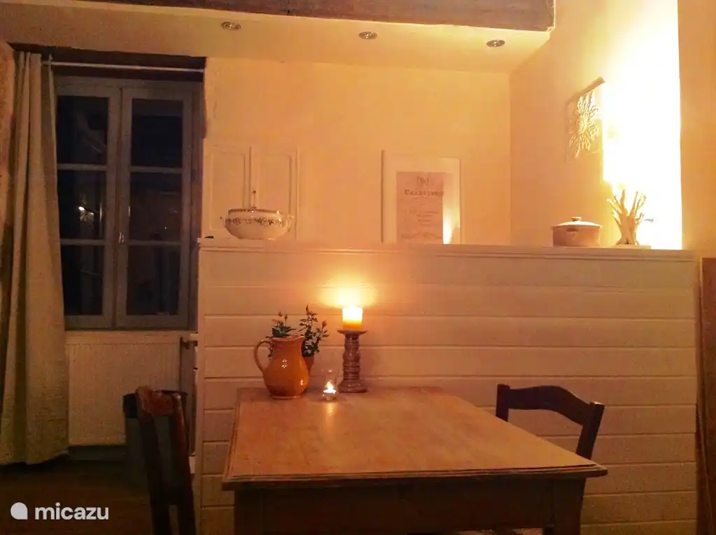The high bar, with the kitchen behind it (gas stove with oven, dishwasher, washing machine). To the left of the window is a large fridge with freezer compartment. And a spacious cupboard.
