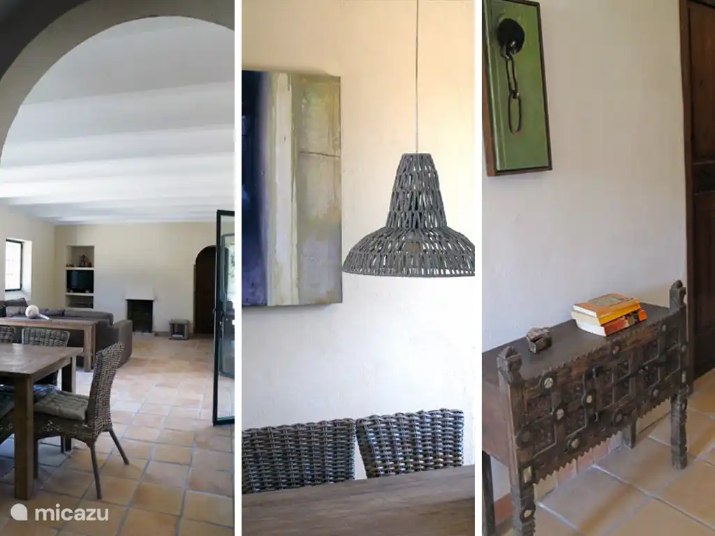 Das geräumige Wohnzimmer mit Lounge-Sitzgruppe, Kamin und großzügigen Essbereich.