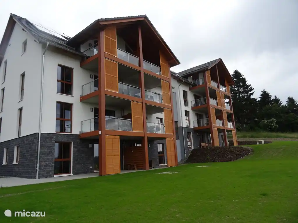 Apartment block. It is an apartment on the garden floor.