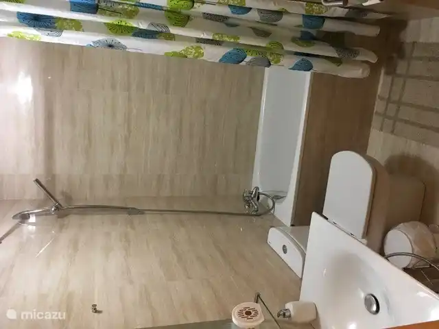 First bathroom with a bath.