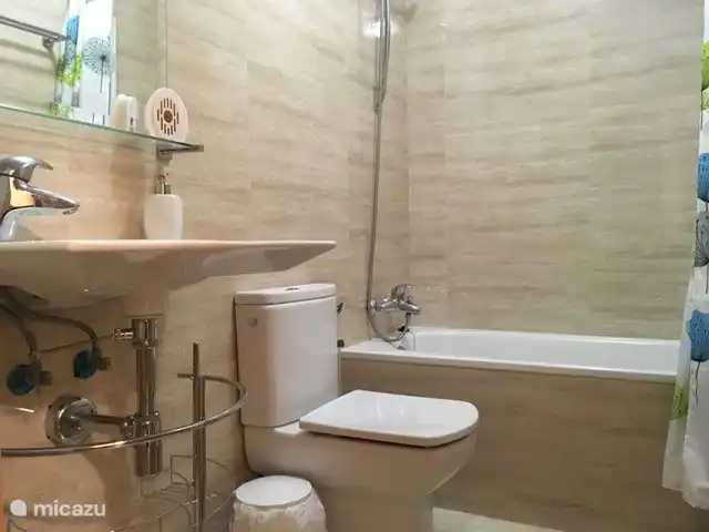 First bathroom with a bath.