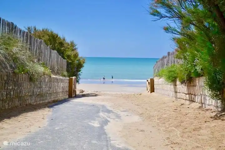 Beach entrance Le Bois Plage, 400 meters from our holiday home.