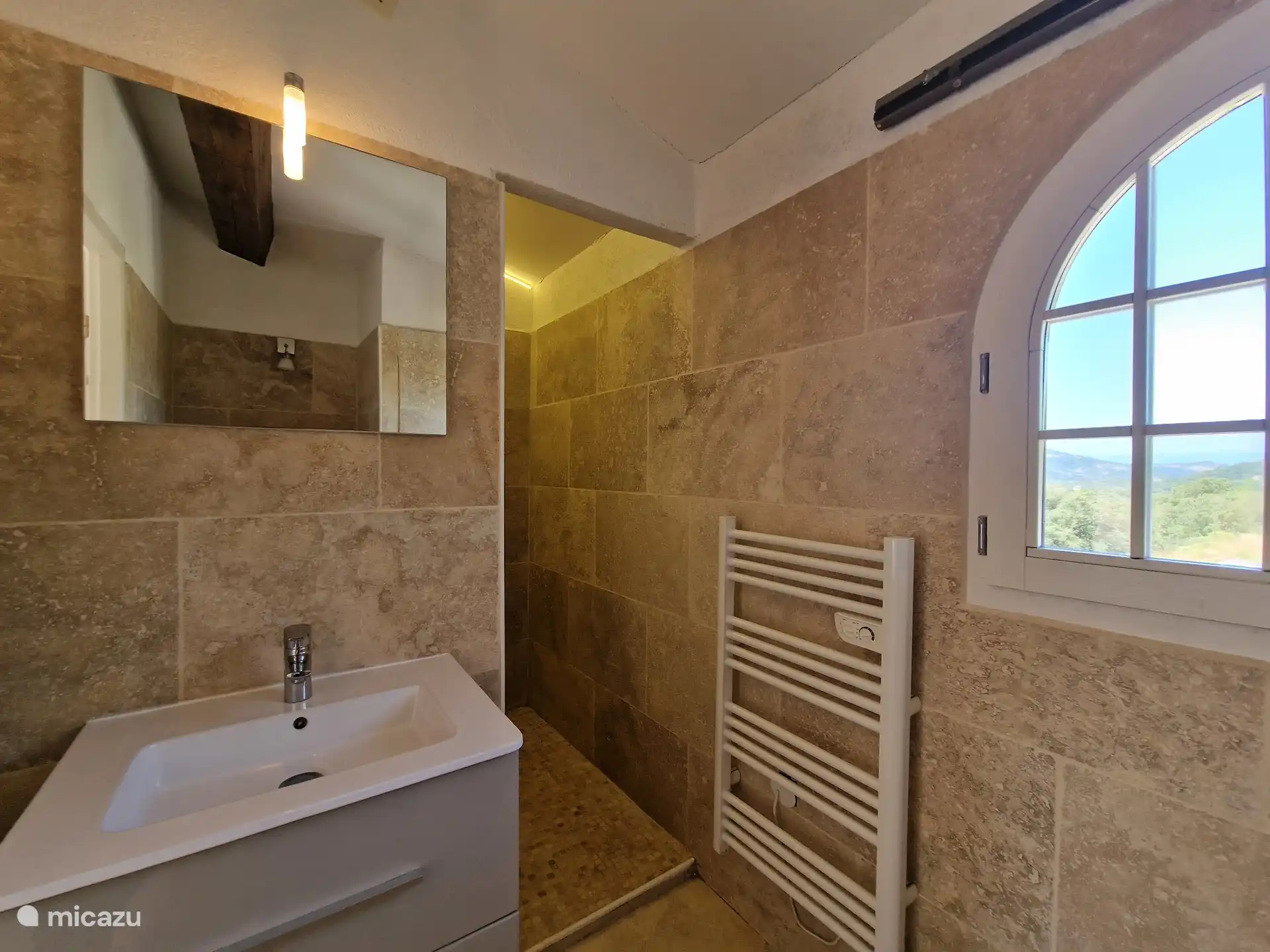 Second bathroom with toilet, sink and walk-in shower