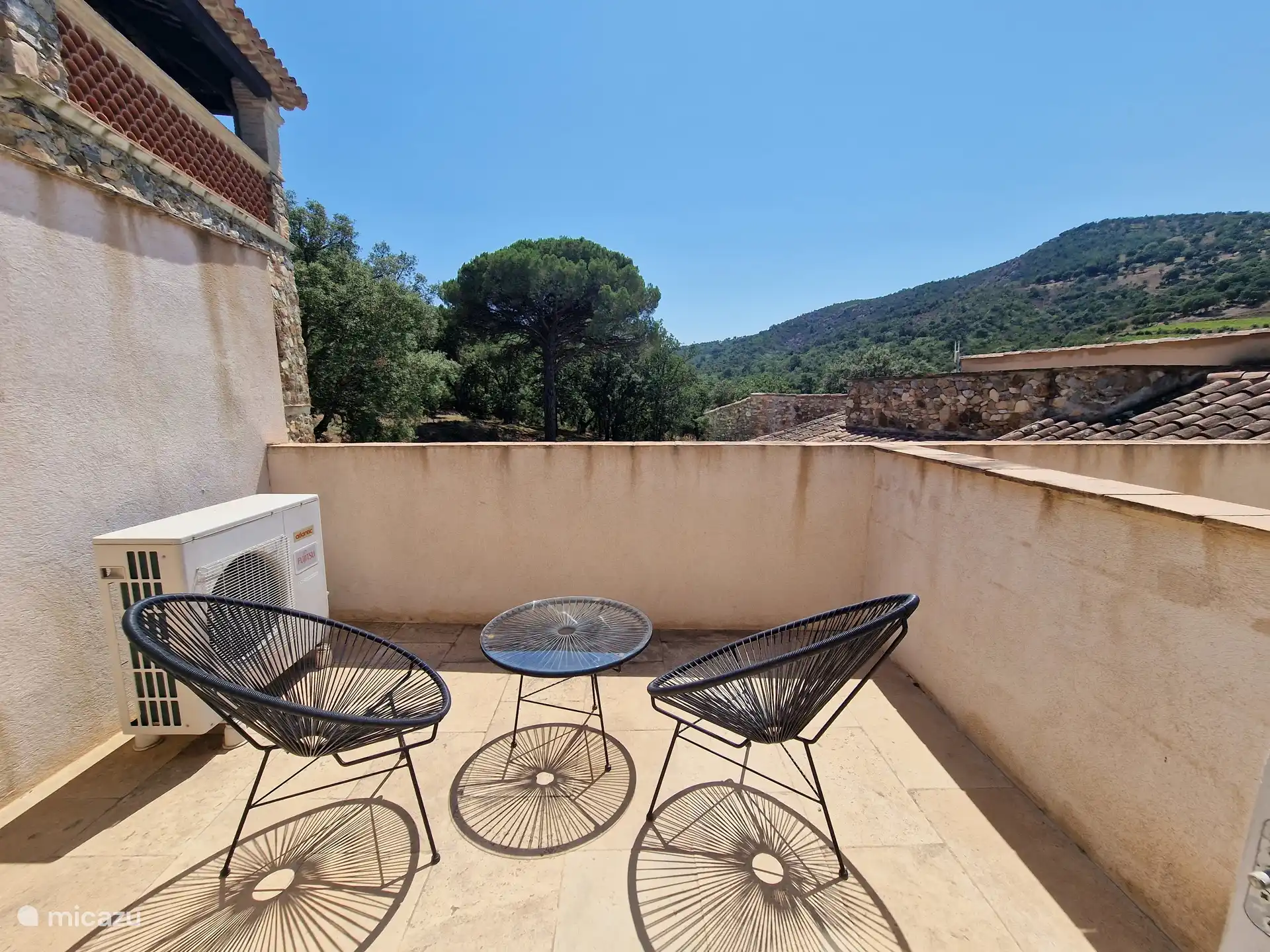 Balcony with beautiful mountain views and pool