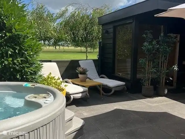 Wellness Lodge Ruigenhoek, Noordwijk | Pays-Bas, Hollande méridionale, Noordwijk - maison de vacances Du jacuzzi une vue magnifique.