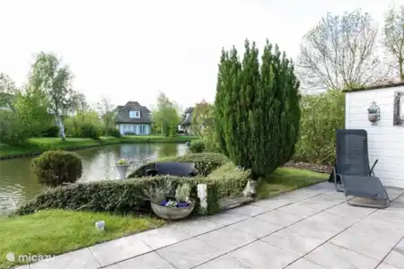 Vakantiehuis Nederland, Zuid-Holland, Hellevoetsluis bungalow Wiels Huis uitzicht vanaf het terras