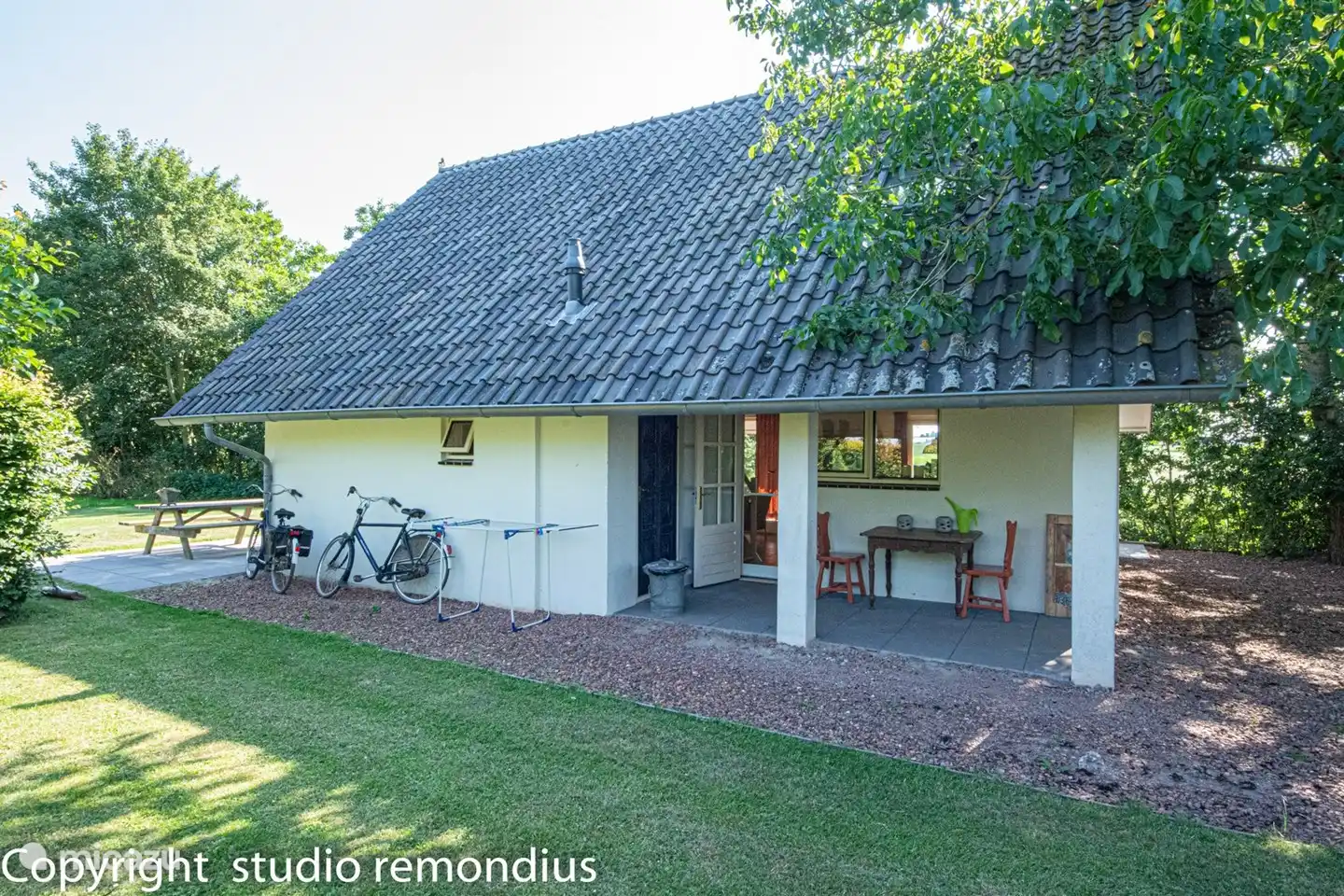 Behind the house a lawn for really hot days