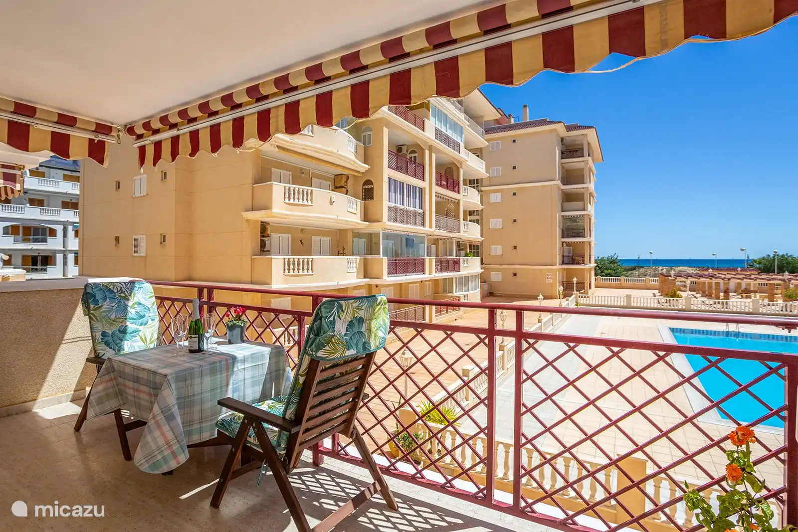 The patio table can be opened further and there are two extra chairs.