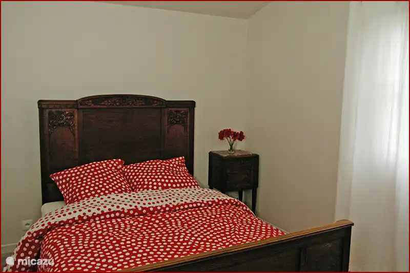 One of the sleeping rooms. In total there are five of them, this one is on the first floor and connects to a terrace at the back of the house.