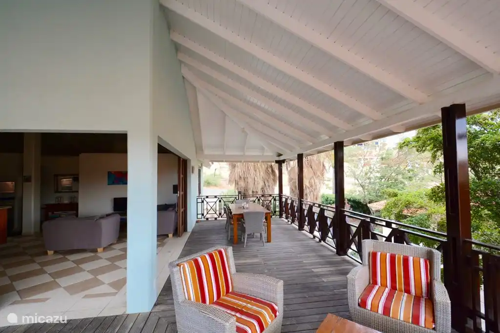 The living room, bar and kitchen as one with the porch!