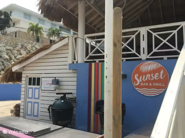 Villa directamente en la playa de Blue Bay en Curazao, Curazao Centro, Blue Bay - villa Hora feliz al atardecer en Blue Bay Beach