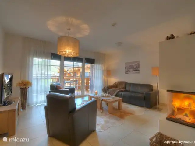 appartement huren in Oostenrijk, Salzburgerland, Kaprun – Kaprun Mountain Resort TopB14 Sfeervol en warm met de mooie open haard.