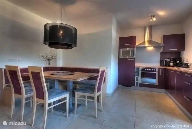 The living room is divided into a luxurious fully equiped kitchen, a spacious sitting area and a living room which features a fireplace where you can enjoy a drink after a long day outside.