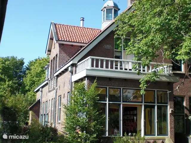Villa monumentale Seulle Etat | Pays-Bas, Frise, Sint Jacobiparochie - villa Véranda et terrasse au sud-ouest.