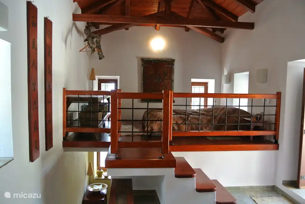 Upstairs is the bedroom and downstairs the bathroom