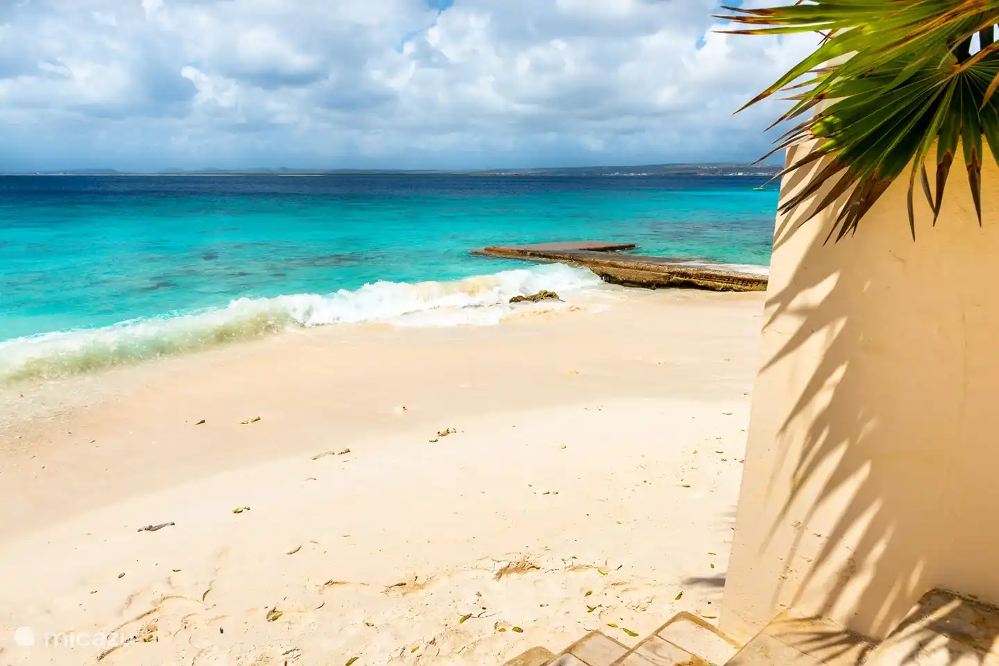 sandy beach in front of the complex