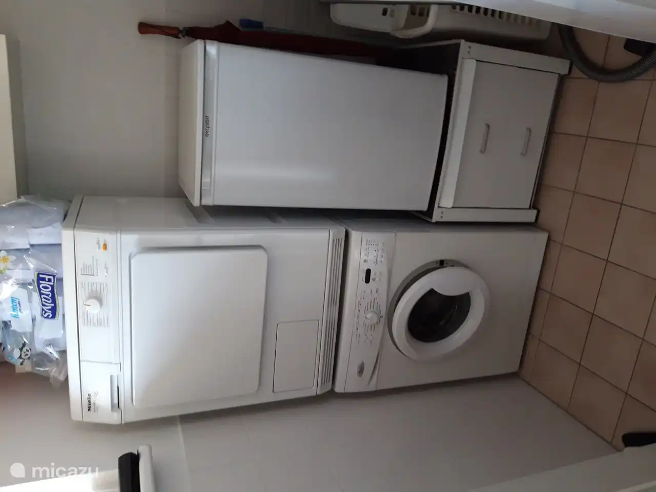 Storage space for washing machine, dryer, freezer, central heating boiler and storage cupboard.