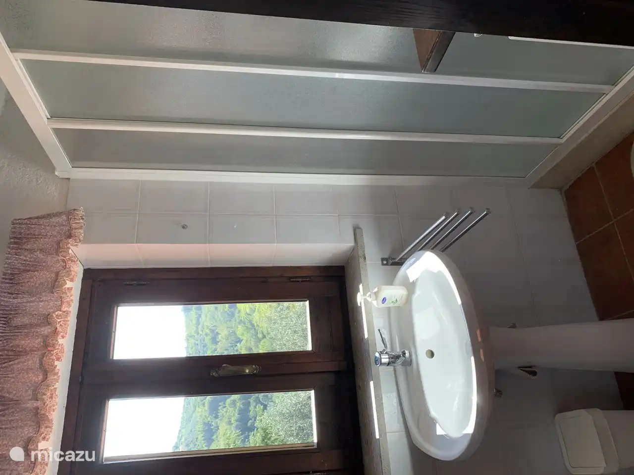 Bathroom 2 located on the first floor. Equipped with toilet, bidet, sink and shower with shower doors.