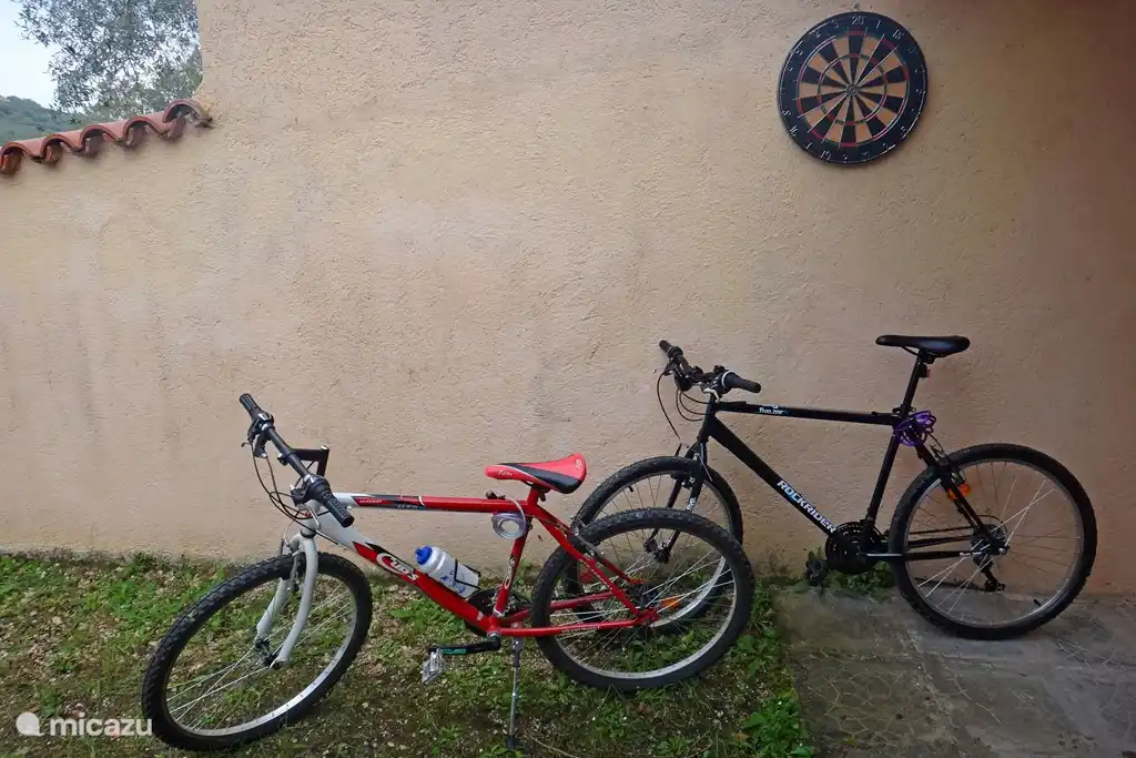 Two mountain bikes with helmets available