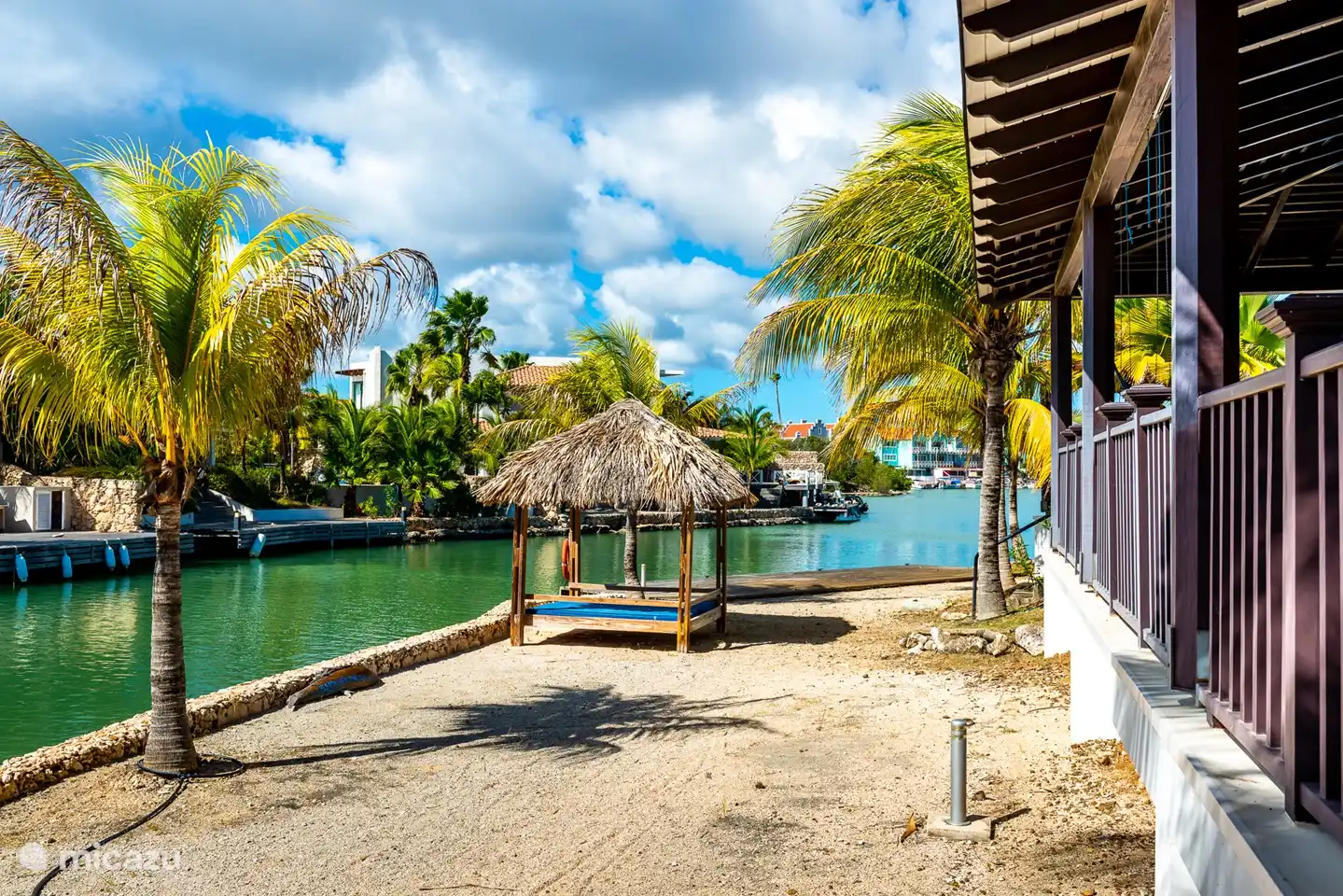 The terrace and the palapa at the back of the villa with a nice view over the lagoon