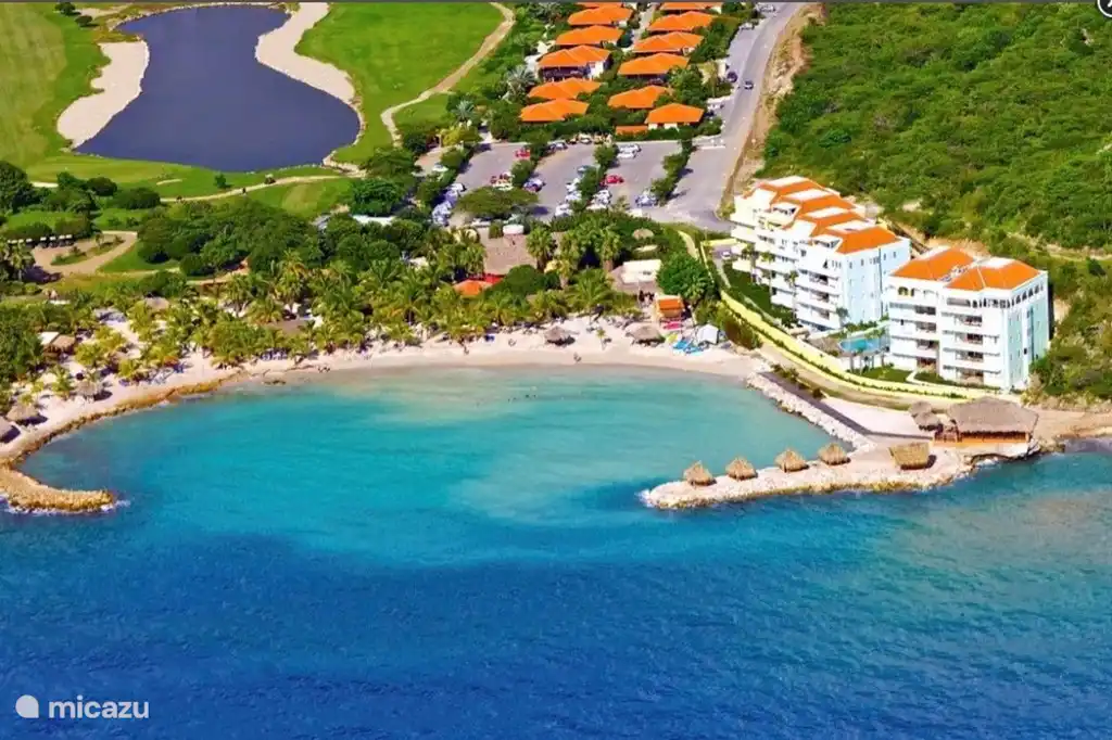 Beach with location of the villas (red roofs)