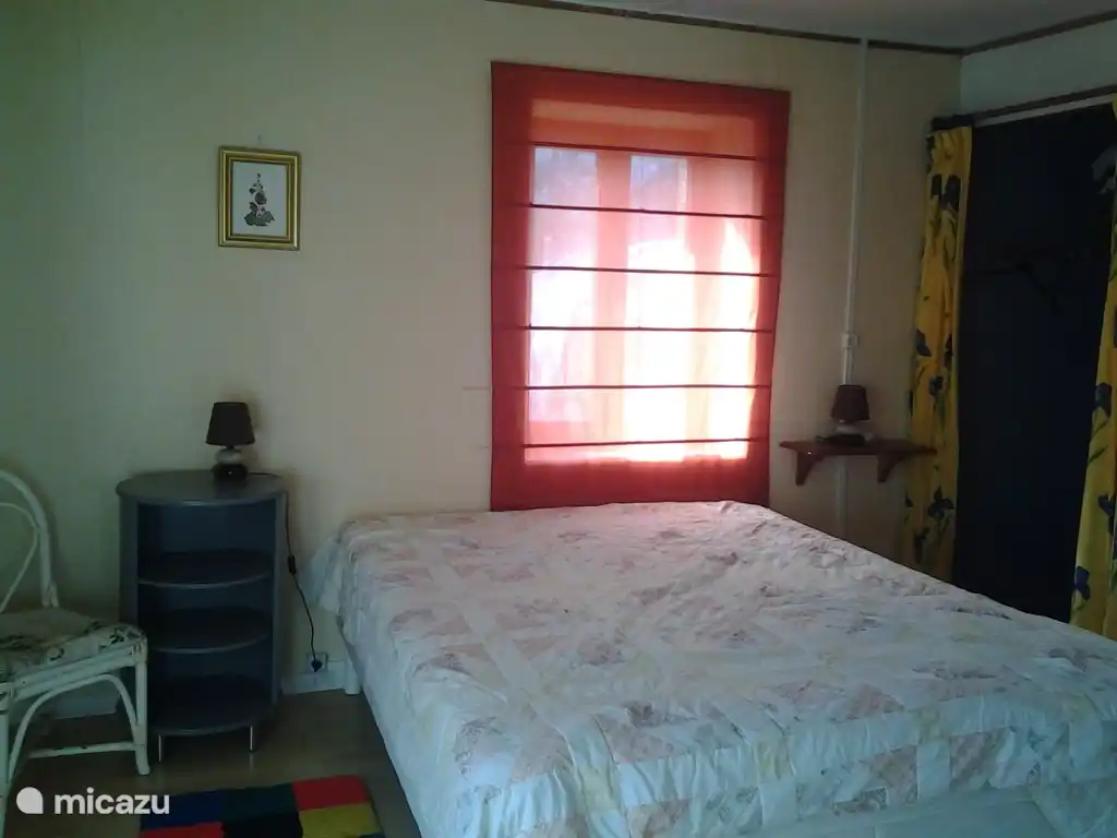 Bedroom with double bed 160x200cm. Casement window. Storage space for linen, suitcases, etc.