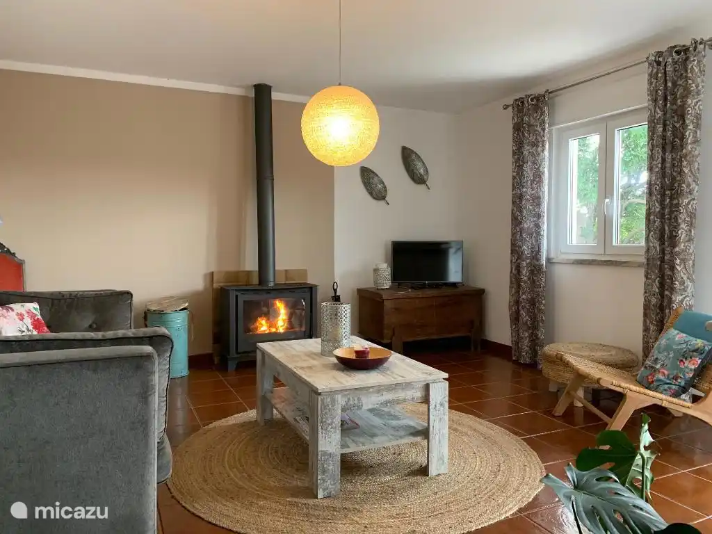 Spacious living room with good wood stove for the winter months. TV and internet.