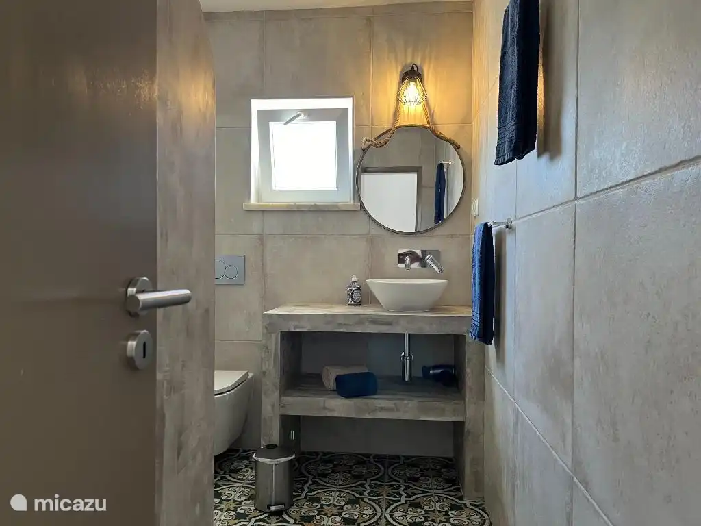 Modern bathroom with spacious walk-in shower.