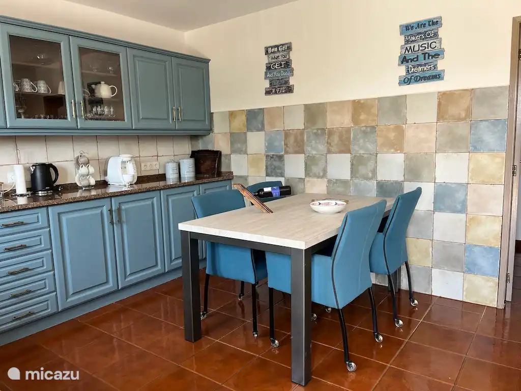 Kitchen with dining table and all necessary equipment. Access to the terrace.