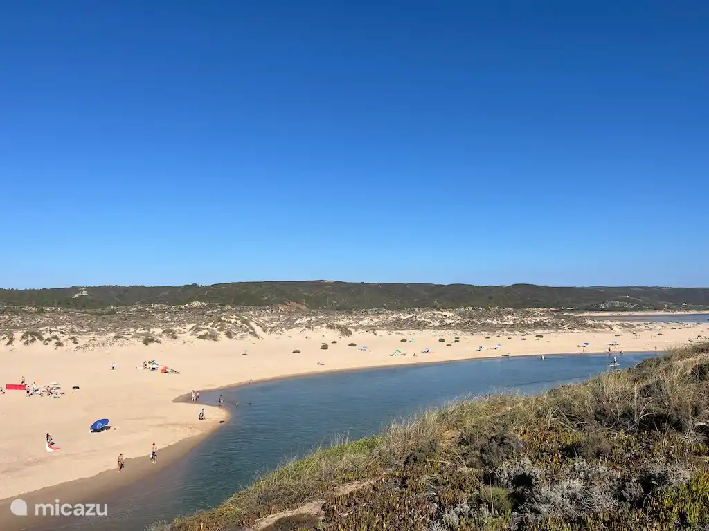 Also beach by the river with calmer water.