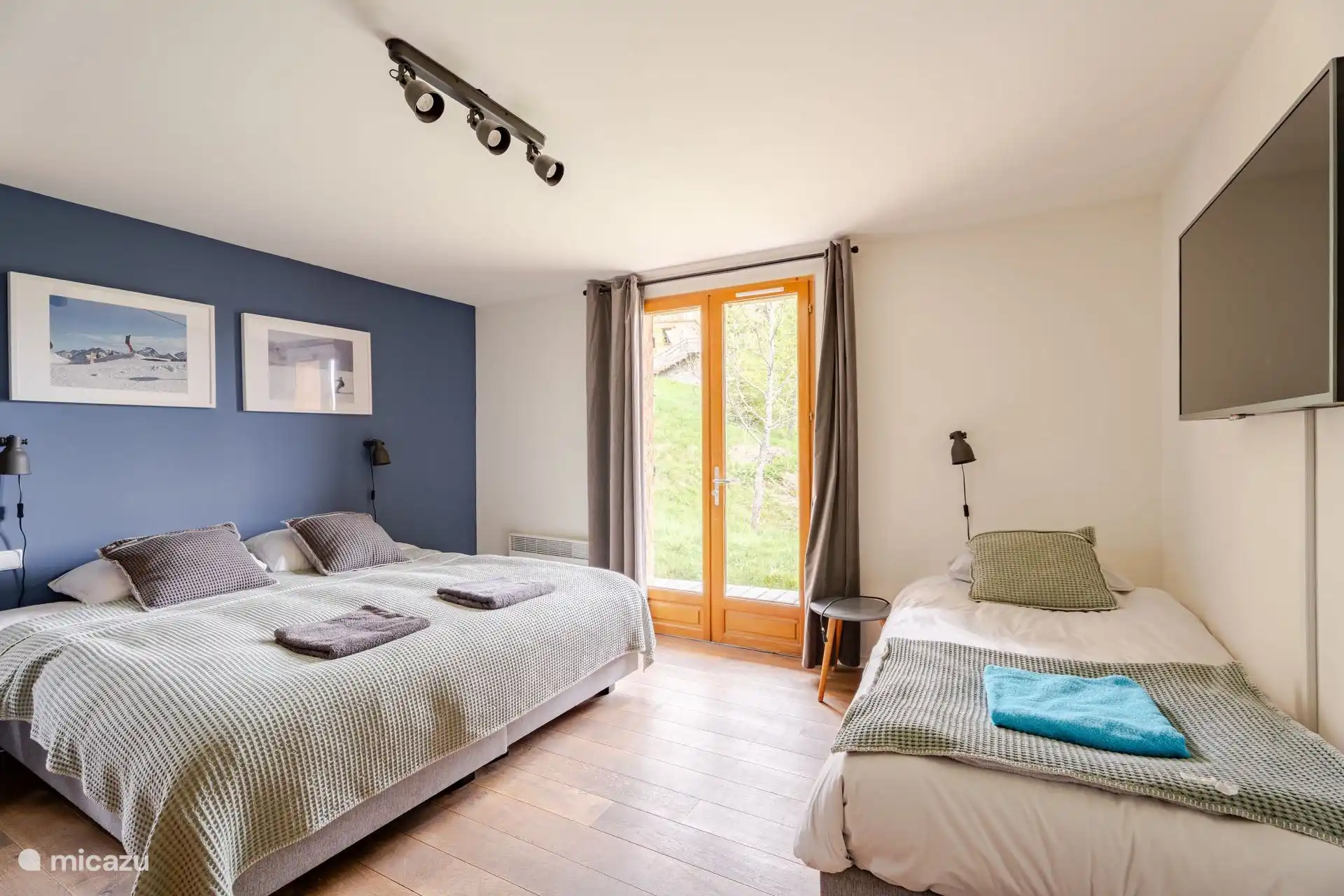 Bedroom 2 - a spacious double bed and an extra bed with fine down duvets