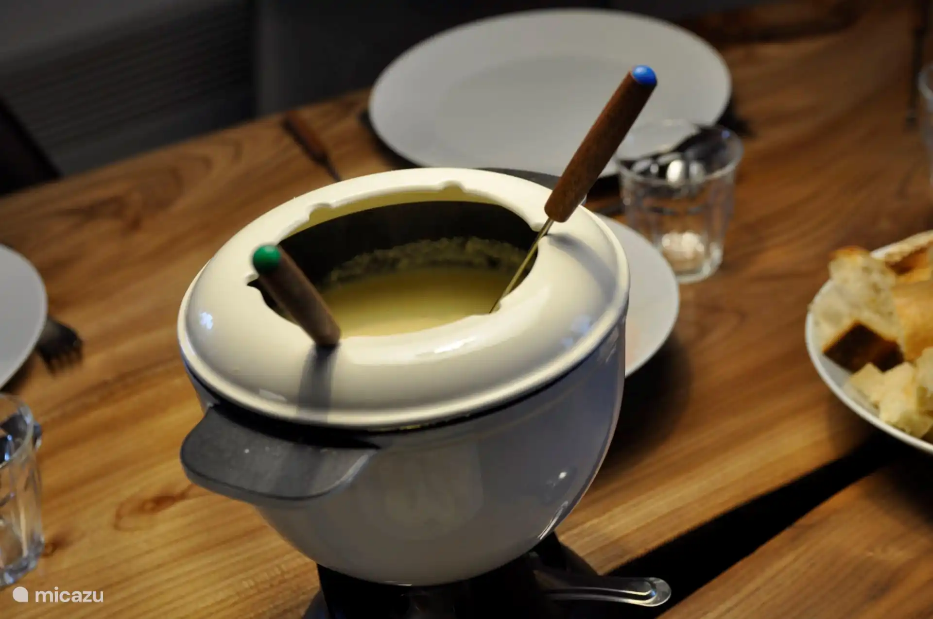 There are two cheese fondue sets in the Chalet