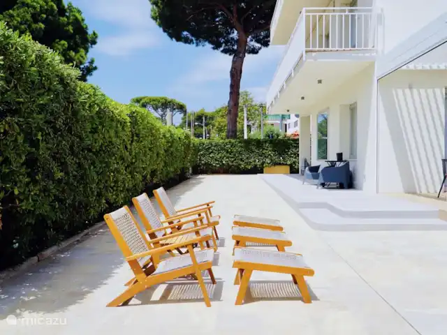 Villa by the sea, near Barcelona in Spain, Barcelona, Castelldefels - villa Around the villa is newly tiled and there are several sitting areas - both in the sun and the shade