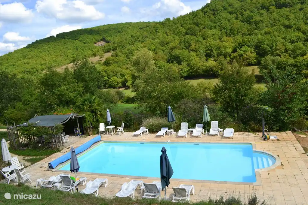The swimming pool with sun terrace