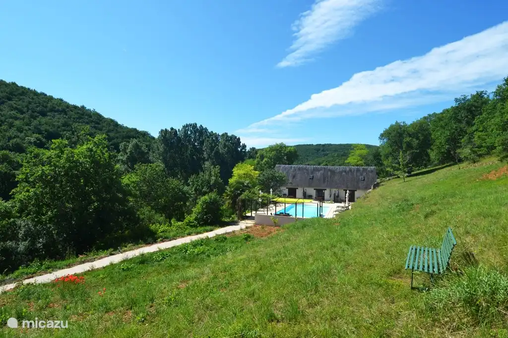 This g&#238;tes in the middle of the green hills