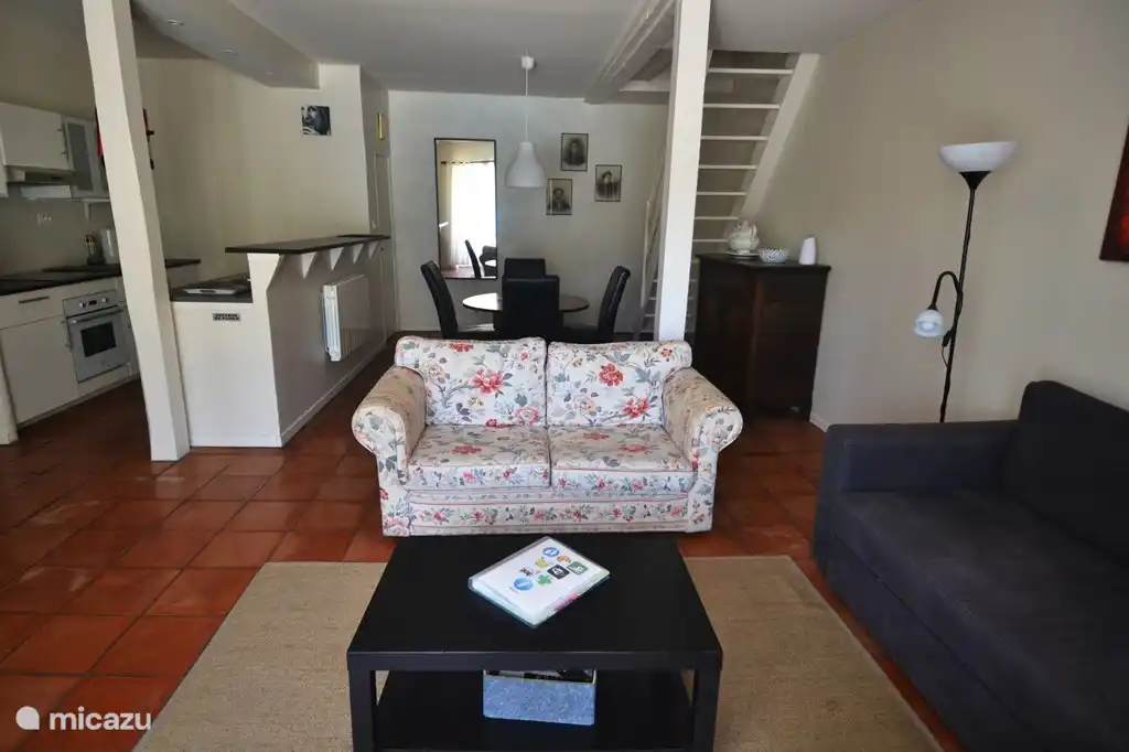 The living room and open kitchen