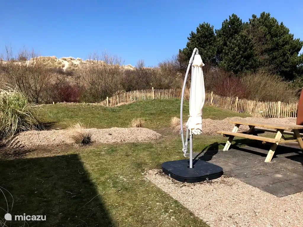 Garden with view on dunes, completely fenced.