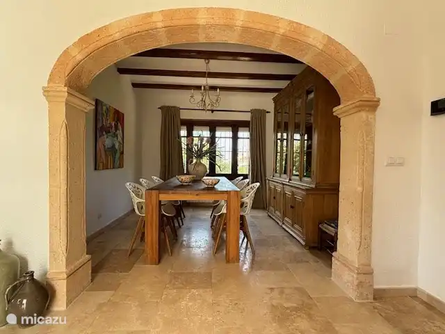 The dining room. In the cupboard are the necessary books and there are also children's games.