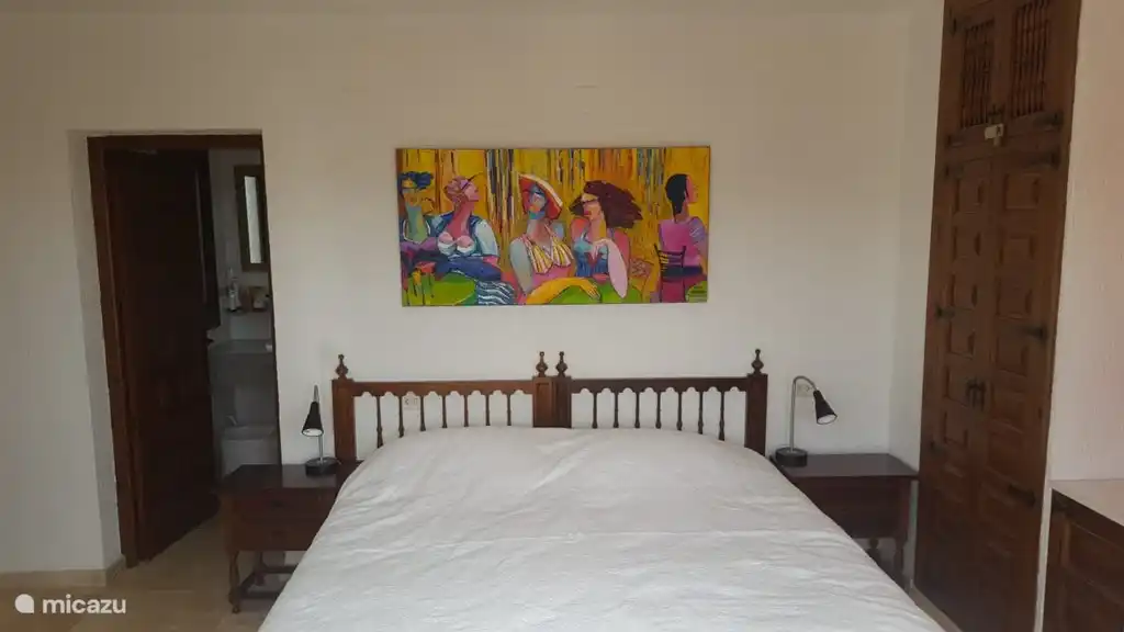 The painting is by a Polish artist. The paintings in the living room, hall and dining room are also hers.