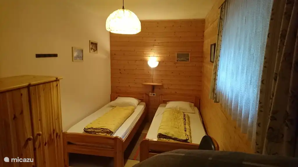 Bedroom with twin beds and room for extra bed