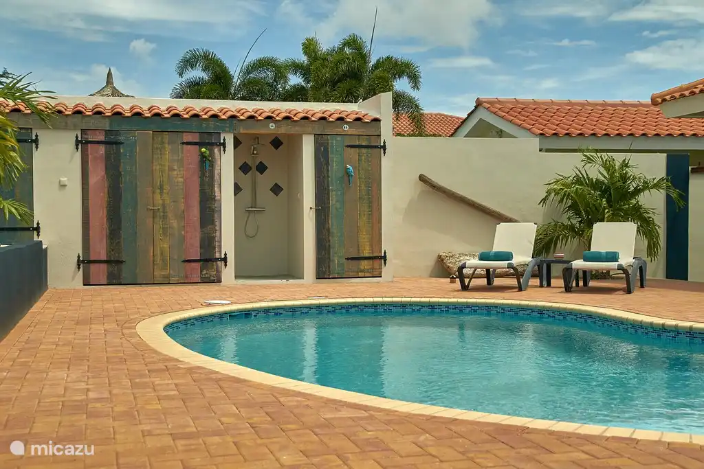 Swimming pool with outside shower and toilet