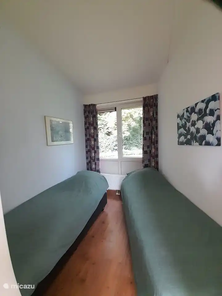 Bedroom with 2 box spring beds.