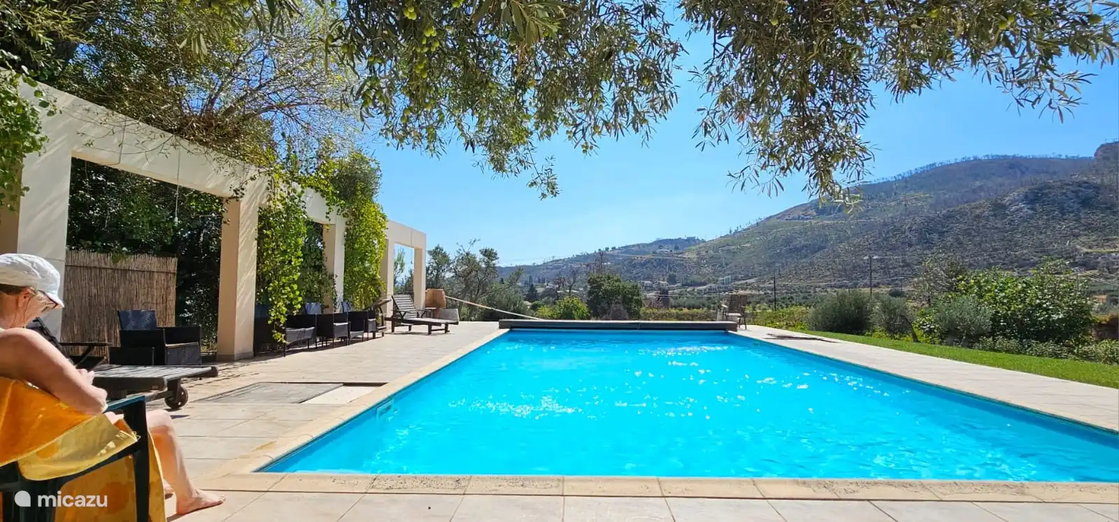 Sunbathing by the pool.
