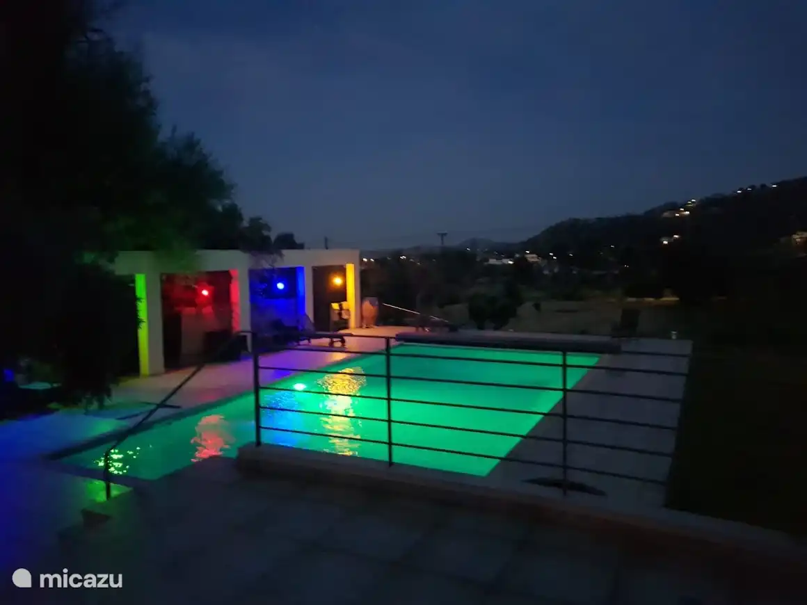Swimming pool with evening lights.