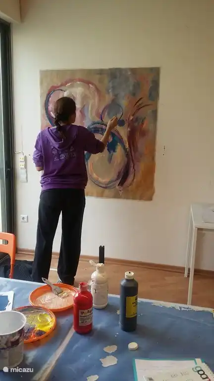 Learning to paint in the studio. You can book a lesson if you want.